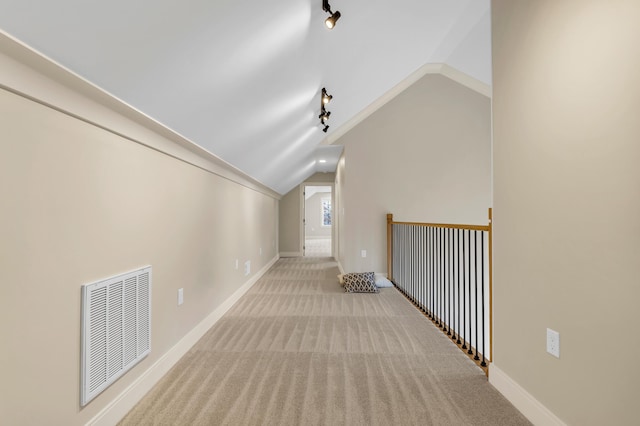 bonus room featuring lofted ceiling, baseboards, visible vents, and carpet flooring