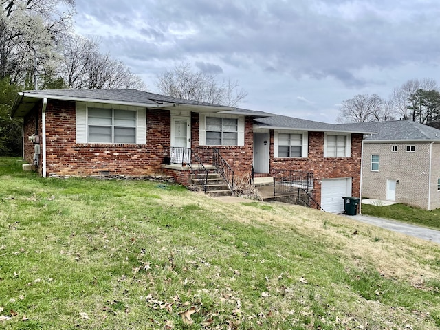 single story home with a garage, driveway, brick siding, and a front yard