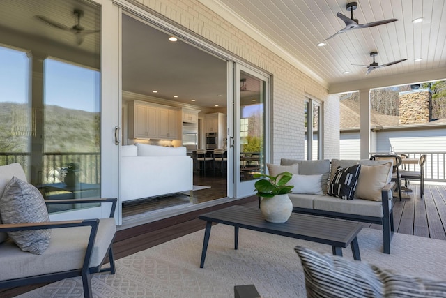 exterior space featuring outdoor lounge area and ceiling fan