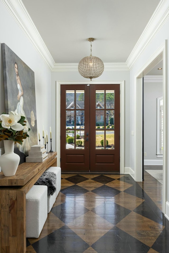 entryway featuring a chandelier, baseboards, ornamental molding, and french doors