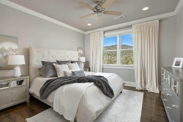 bedroom featuring visible vents, crown molding, baseboards, dark wood finished floors, and recessed lighting