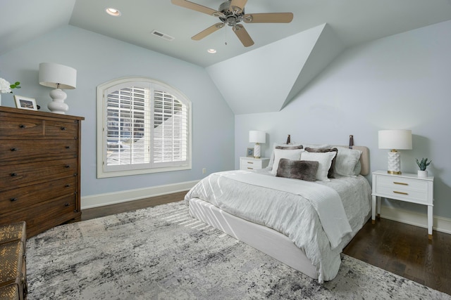 bedroom featuring visible vents, lofted ceiling, baseboards, and wood finished floors