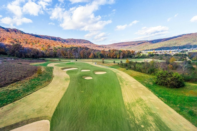 view of property's community with golf course view and a mountain view