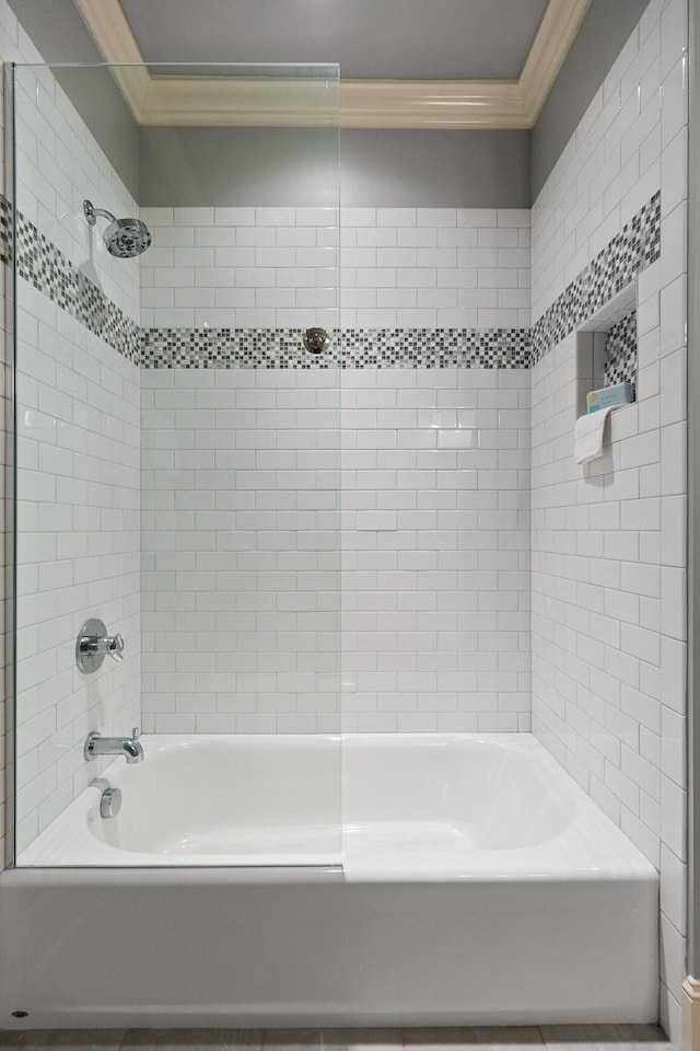 bathroom with tub / shower combination and ornamental molding