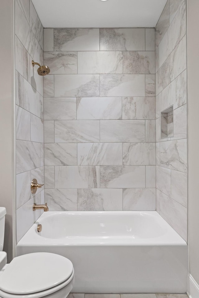 bathroom featuring toilet and washtub / shower combination