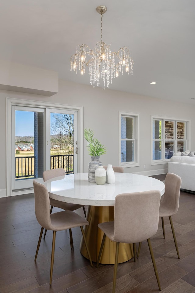 dining room with recessed lighting, an inviting chandelier, and dark wood-style flooring