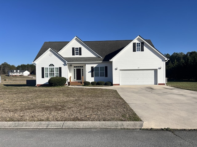 view of front of property featuring a garage, concrete driveway, and a front lawn