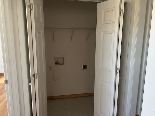 washroom with laundry area, light tile patterned floors, baseboards, hookup for a washing machine, and electric dryer hookup