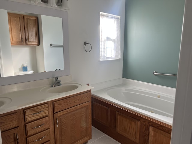 bathroom featuring a garden tub, double vanity, a sink, and tile patterned floors