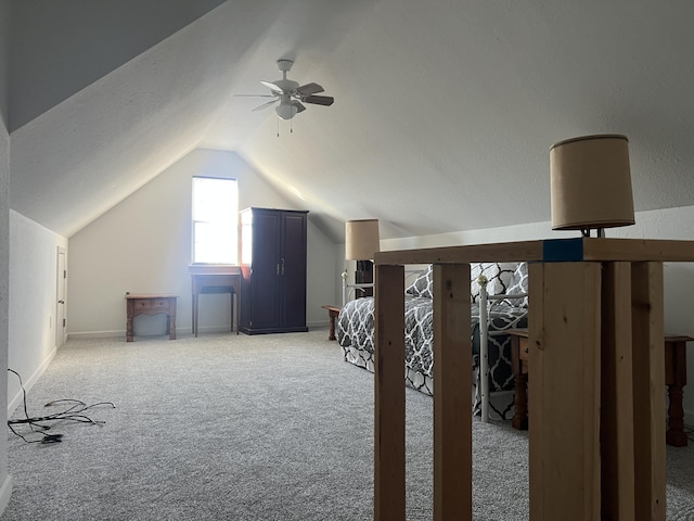 additional living space with light carpet, baseboards, vaulted ceiling, and a ceiling fan