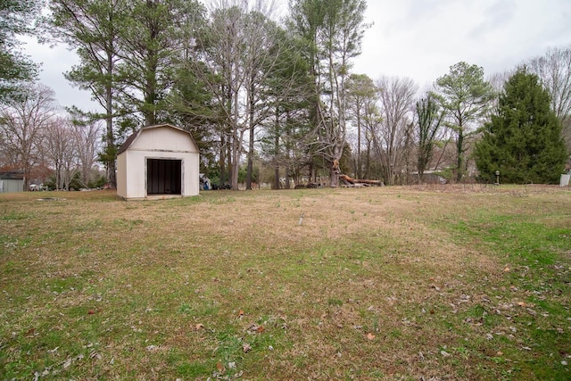 view of yard with a storage unit and an outbuilding