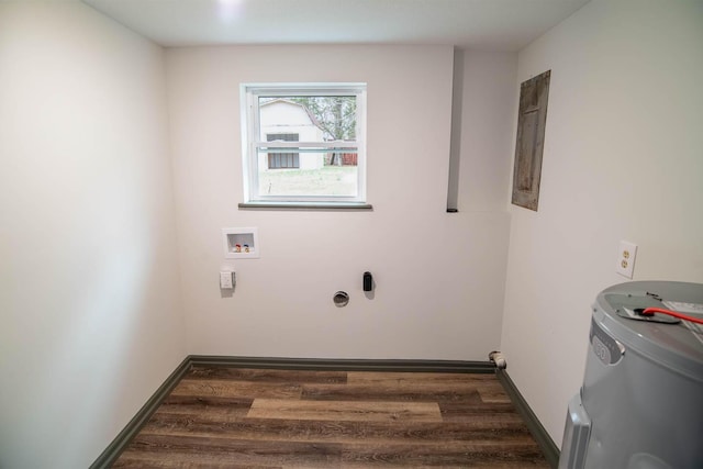 clothes washing area with hookup for a washing machine, dark wood finished floors, electric panel, and baseboards