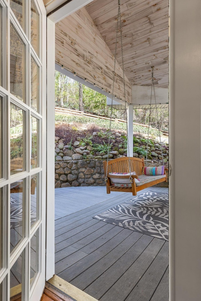 entryway with wooden ceiling, hardwood / wood-style flooring, vaulted ceiling, and a sunroom