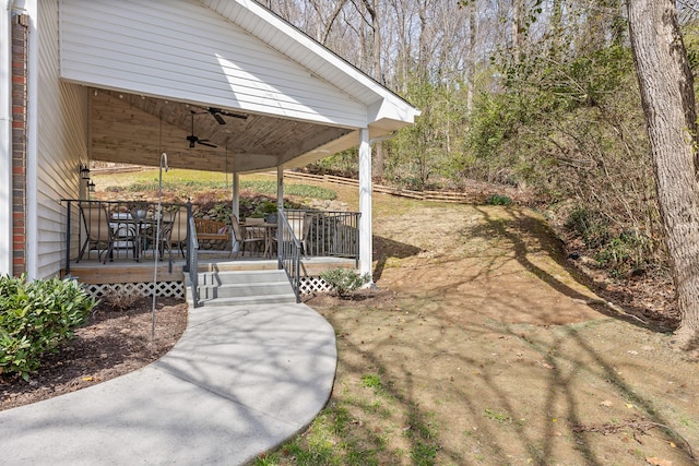 view of yard with a ceiling fan