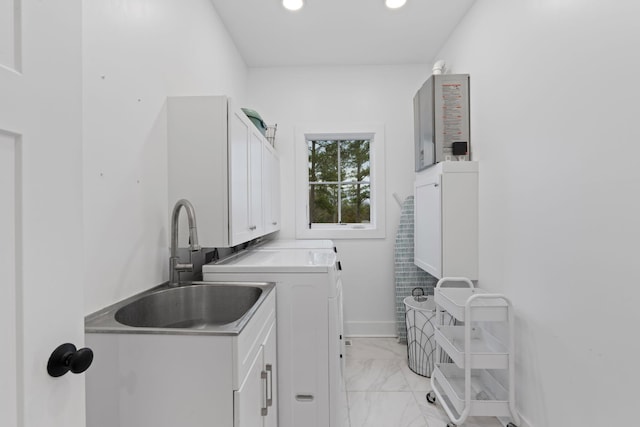 laundry area with marble finish floor, cabinet space, a sink, washer and dryer, and baseboards