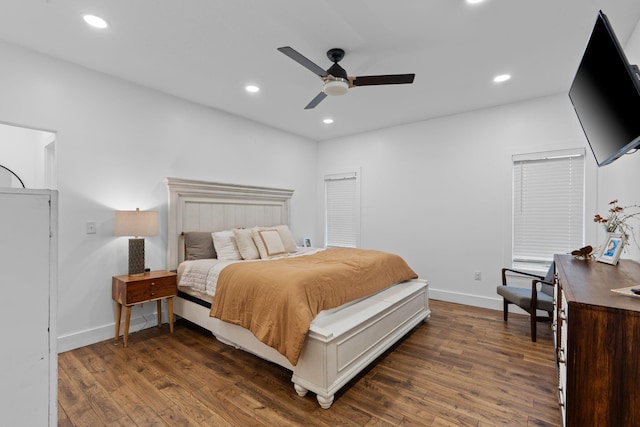 bedroom with a ceiling fan, recessed lighting, dark wood finished floors, and baseboards