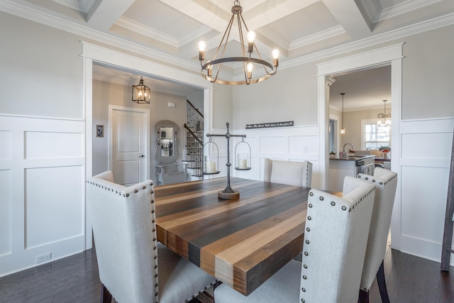 dining space featuring stairway, a chandelier, dark wood finished floors, and beam ceiling