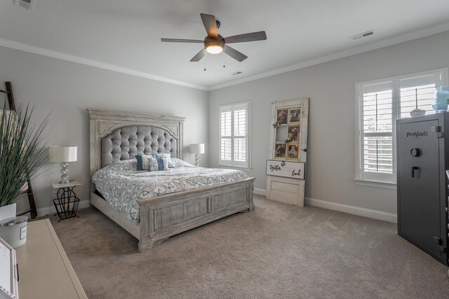 bedroom featuring baseboards, ornamental molding, visible vents, and light colored carpet