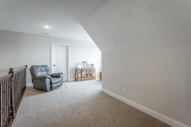 living area with carpet floors and baseboards