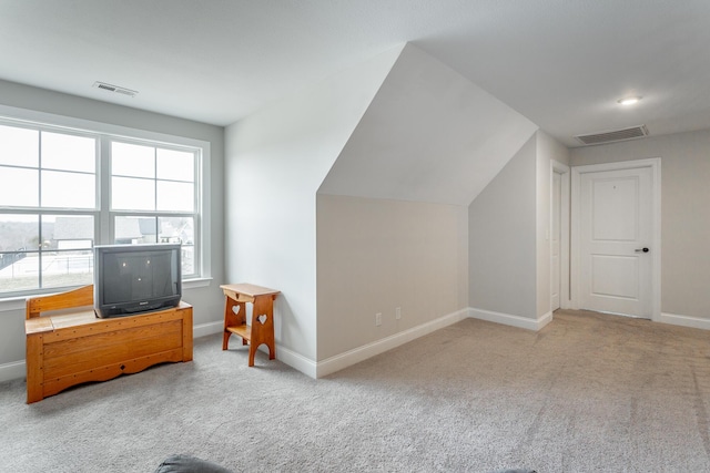 bonus room with carpet floors, visible vents, and baseboards