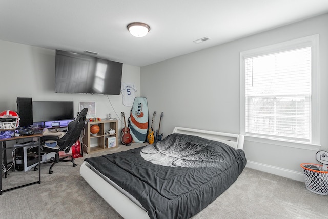 bedroom featuring carpet flooring, visible vents, and baseboards