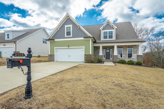 craftsman house featuring concrete driveway, covered porch, a garage, stone siding, and a front lawn