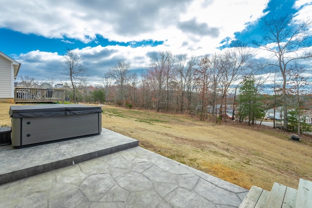 view of yard with a patio and a hot tub