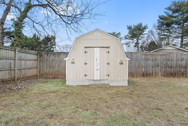 view of shed with a fenced backyard