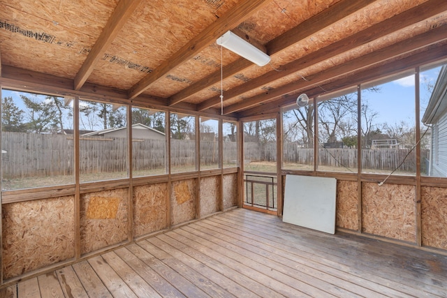 unfurnished sunroom featuring a wealth of natural light