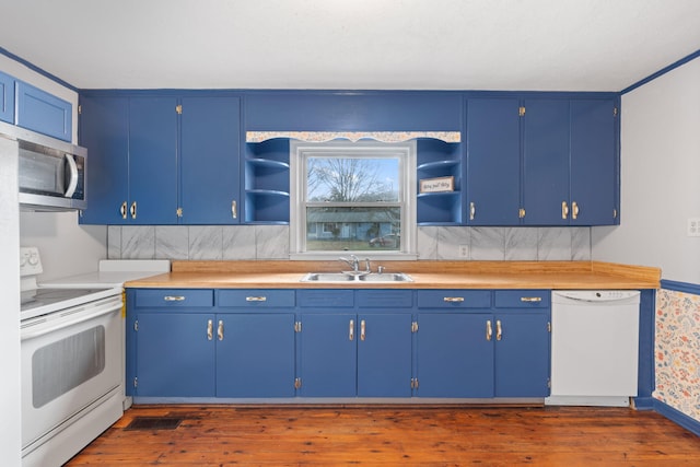 kitchen with white appliances, dark wood-style floors, open shelves, and a sink