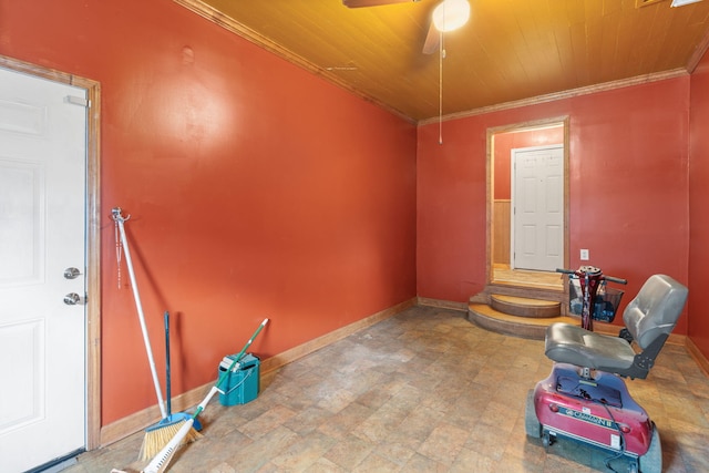 unfurnished room featuring a ceiling fan, crown molding, wood ceiling, and baseboards