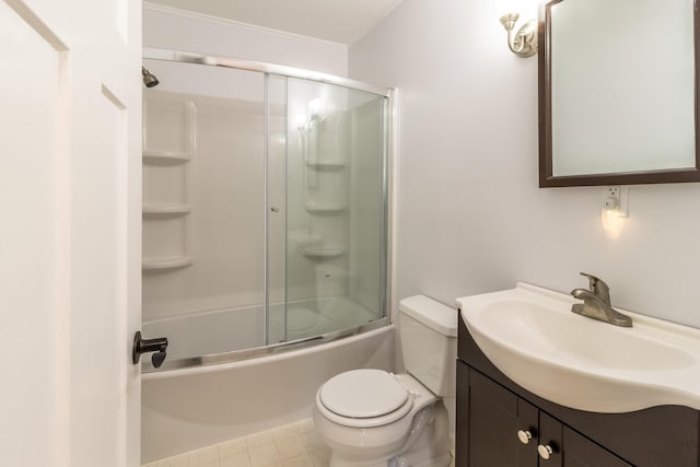 full bath with bath / shower combo with glass door, vanity, toilet, and tile patterned floors