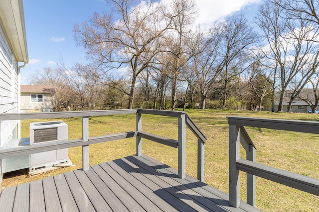 wooden deck featuring a yard