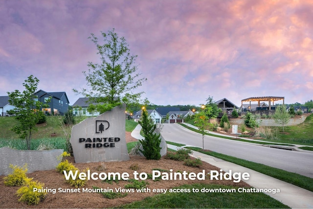 community / neighborhood sign featuring a residential view