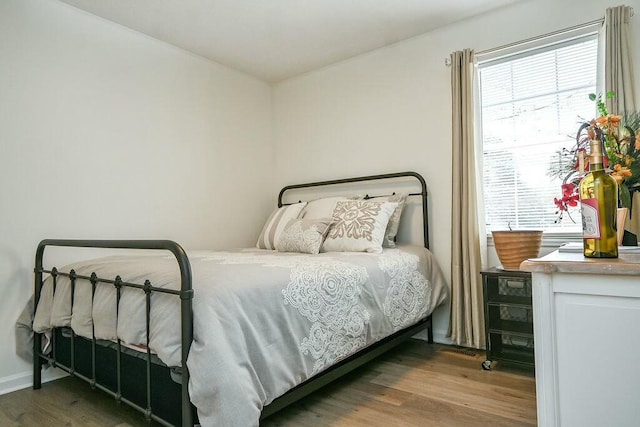 bedroom featuring wood finished floors