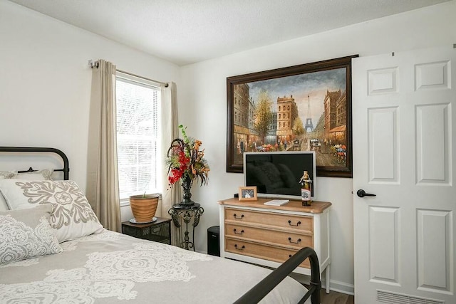 bedroom featuring visible vents