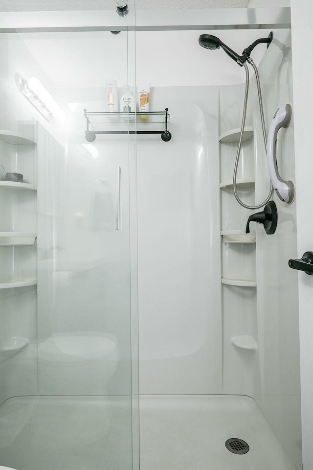 bathroom with a stall shower