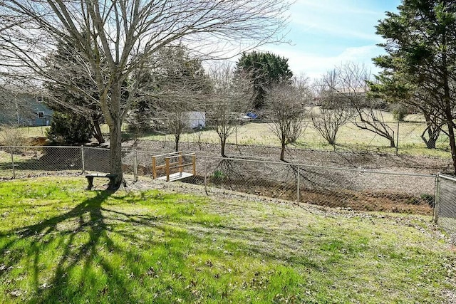 view of yard featuring fence