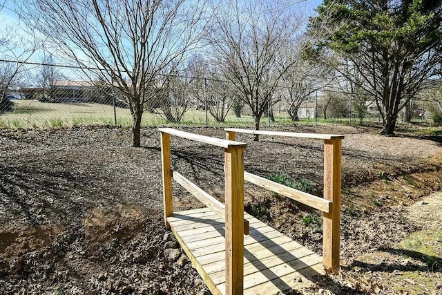 view of property's community with fence