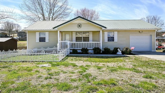 ranch-style home with covered porch, an attached garage, fence, metal roof, and driveway