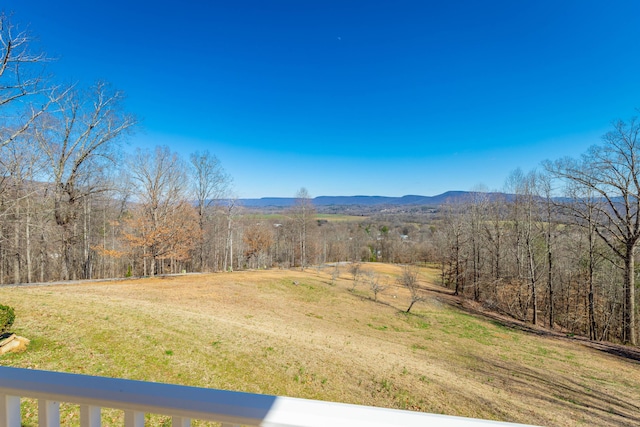 view of mountain feature with a view of trees