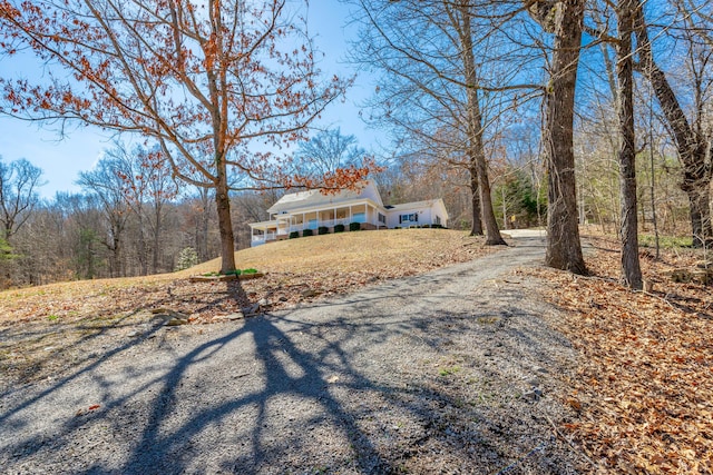 view of front of property featuring covered porch and driveway