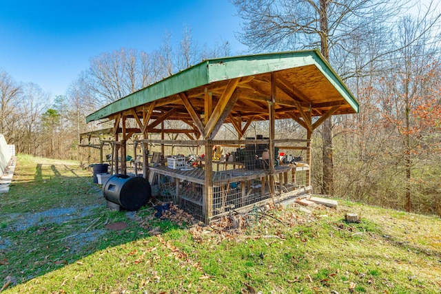 view of home's community featuring an outbuilding