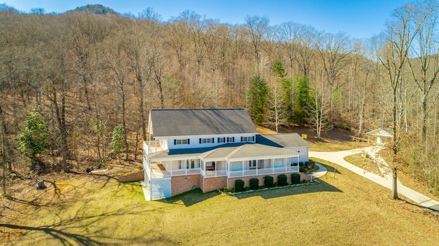 bird's eye view featuring a wooded view