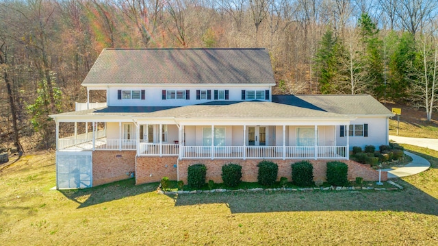 view of front of house with a front yard and covered porch