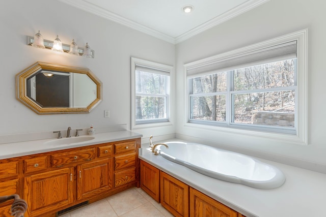 full bath with visible vents, tile patterned floors, crown molding, vanity, and a bath