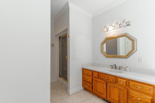 full bath with vanity, baseboards, ornamental molding, tile patterned floors, and an enclosed shower