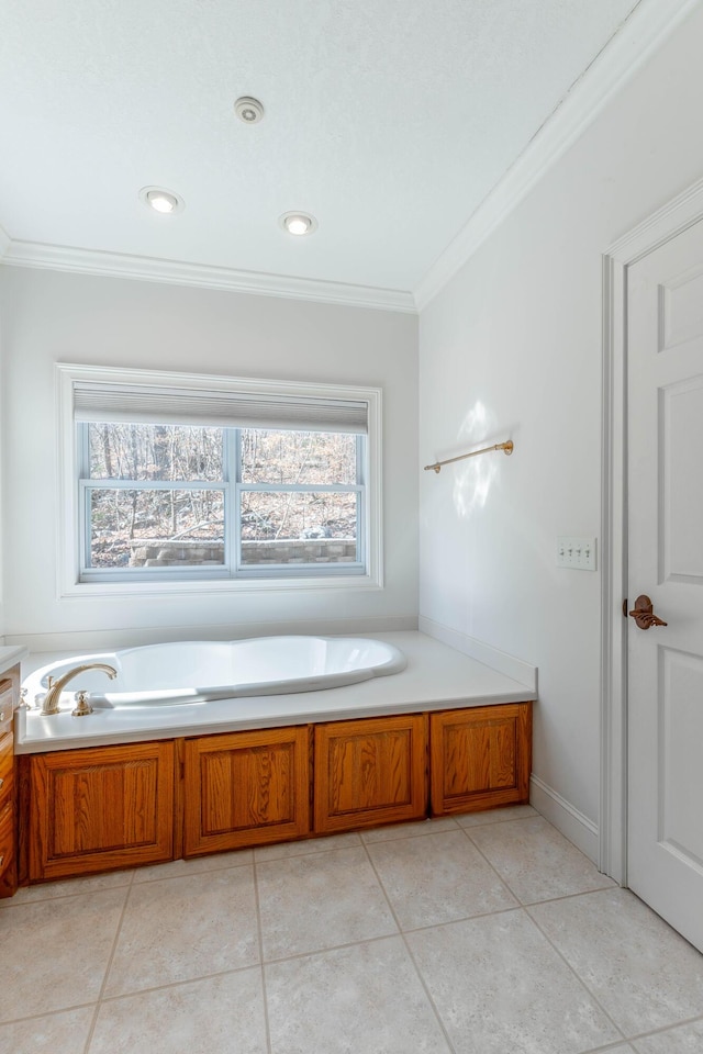 bathroom featuring tile patterned floors, crown molding, and a bath