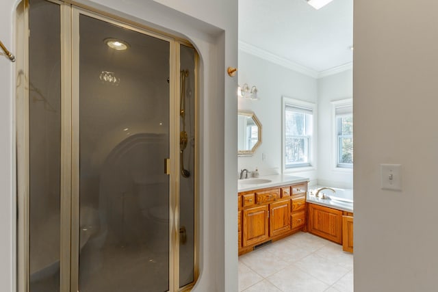 bathroom with crown molding, a shower stall, vanity, tile patterned flooring, and a bath