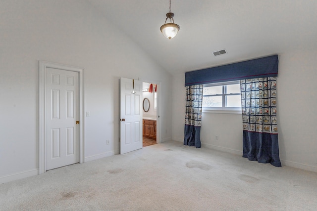 unfurnished bedroom featuring high vaulted ceiling, carpet, visible vents, and baseboards